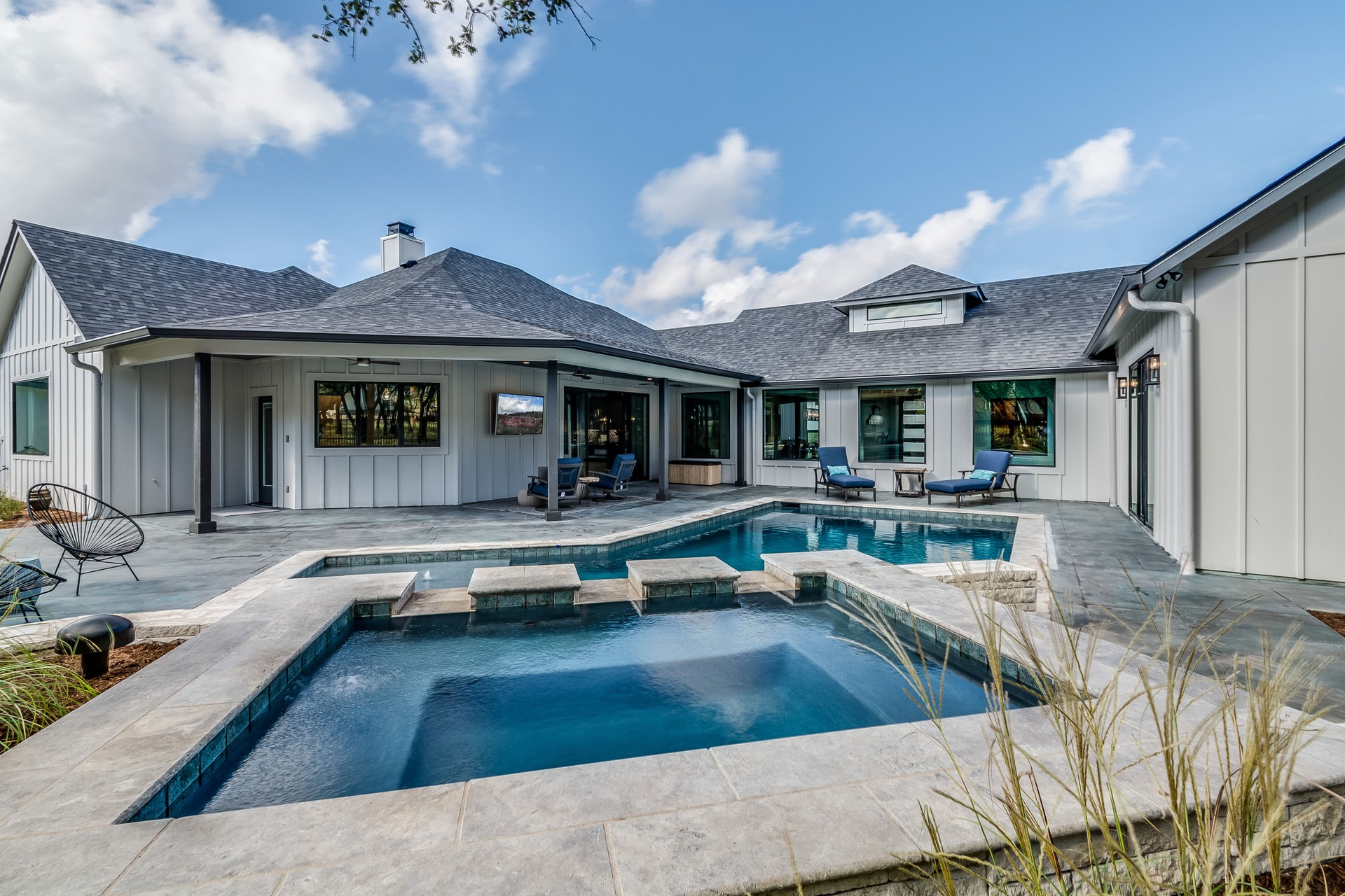 Custom designed swimming pool in backyard of house
